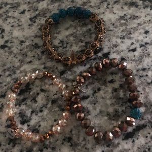 3 erimish stack bracelets. Leopard and teal brown and cream colors.
